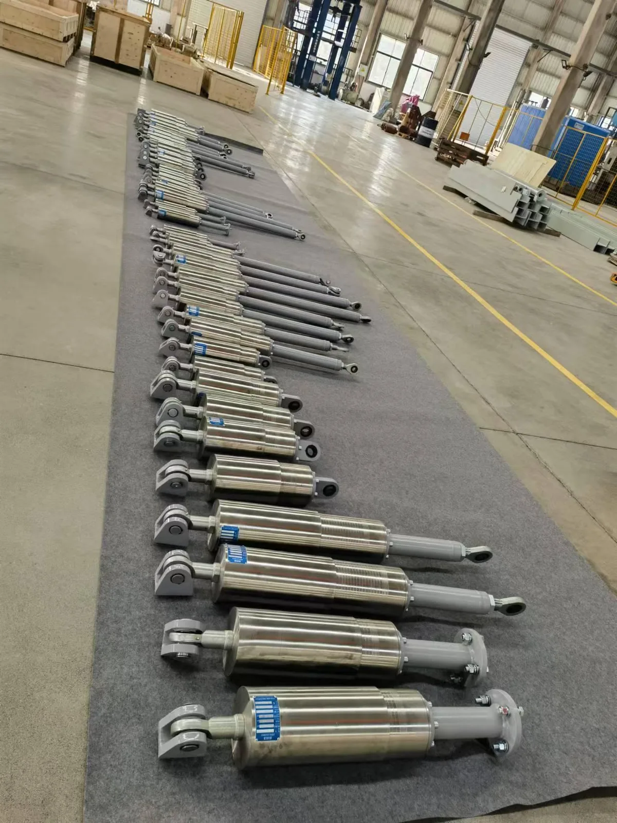 Batch of cylindrical damping units arranged on the factory floor