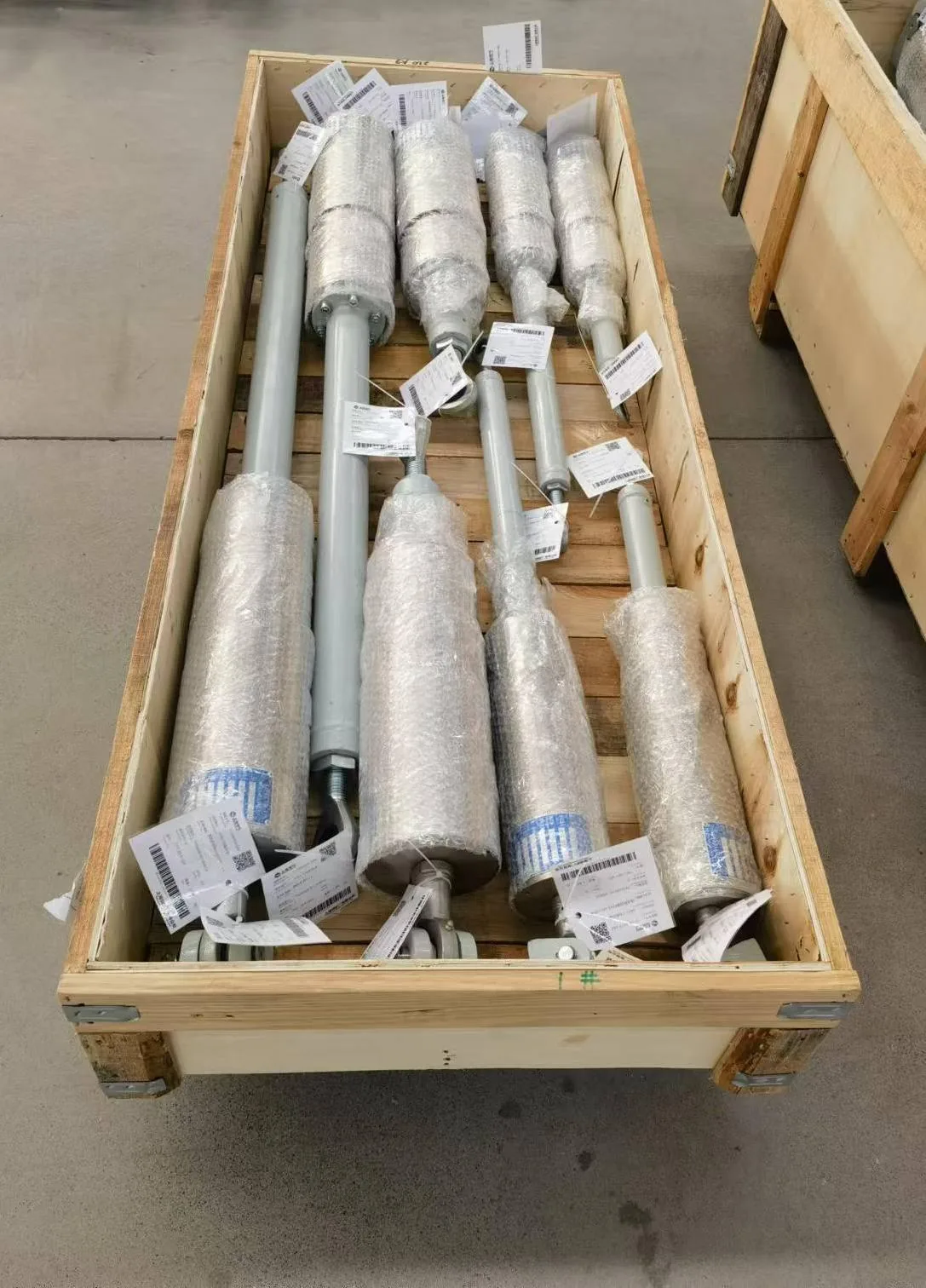 Damping units packed inside a wooden shipping crate